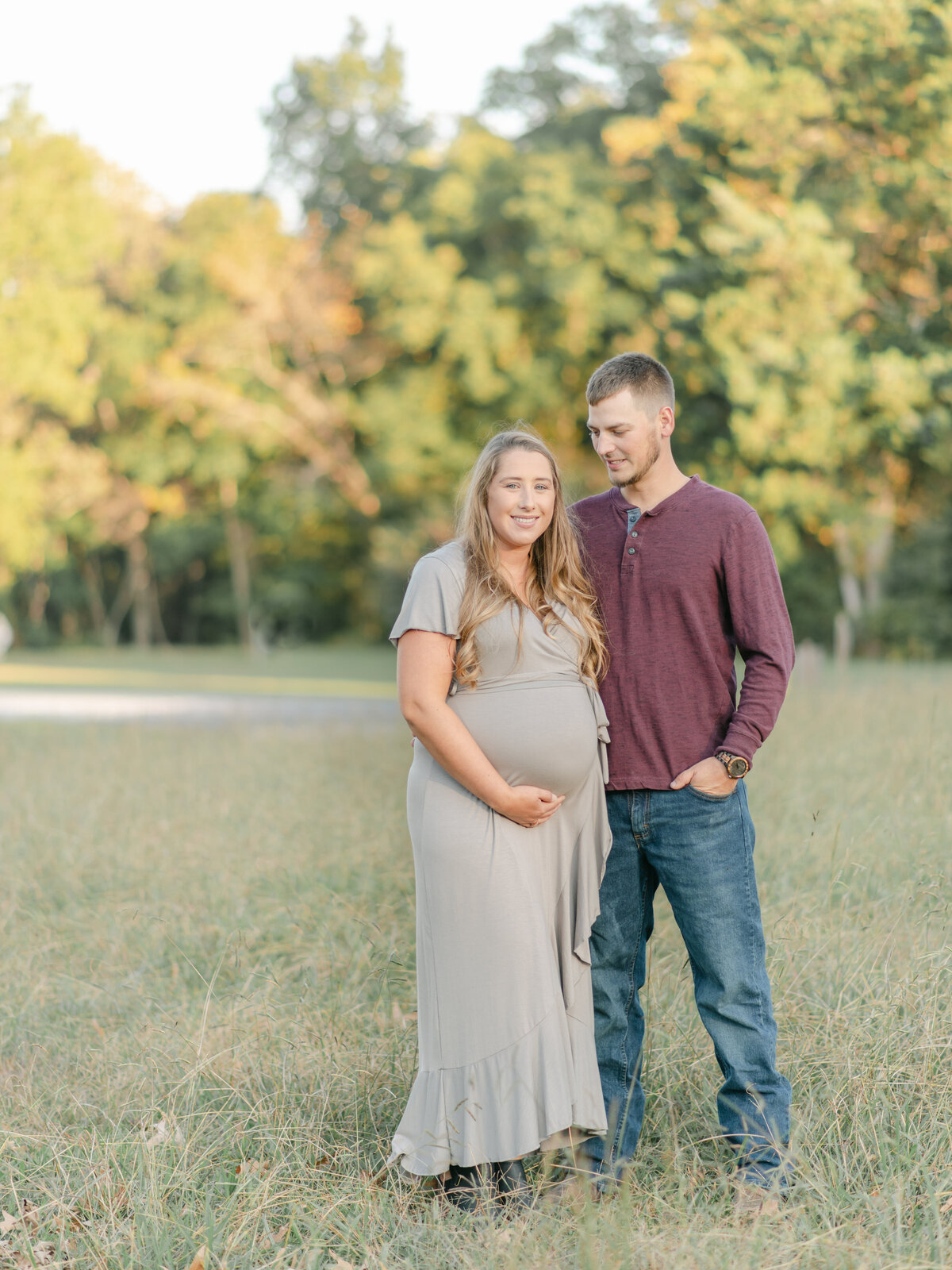 Young dad looking at pregnant mom.