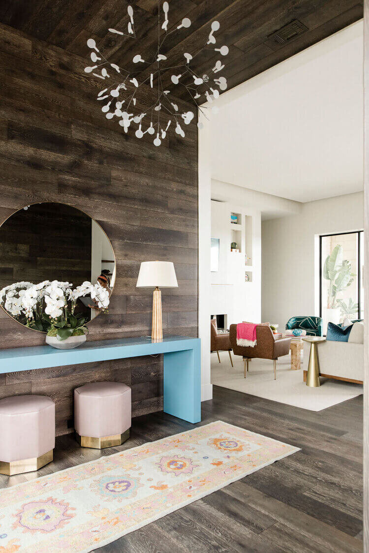 oyster creek studios austin barton creek blue side table with modern lighting and rug overlooking seating area