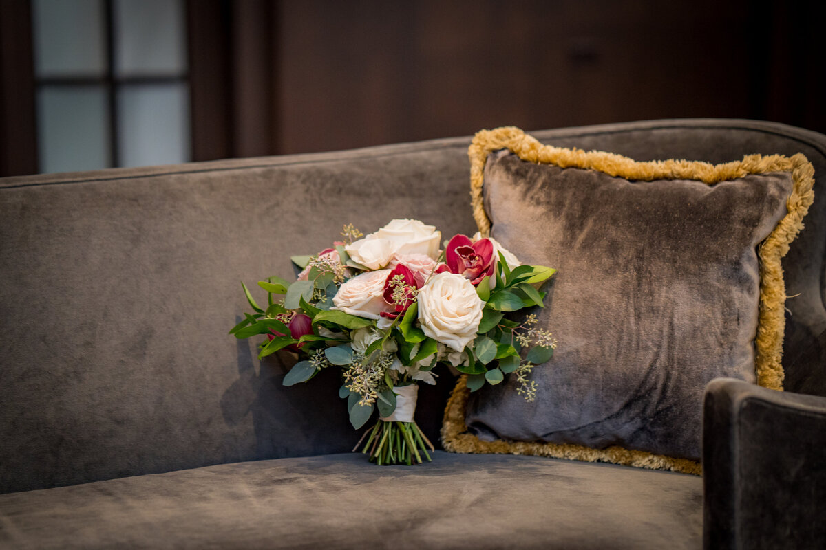 Bridal bouquet on velvet sofa