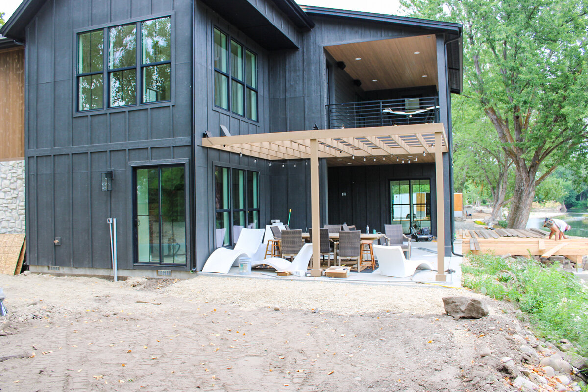 home with black exterior in process of being built on private grounds