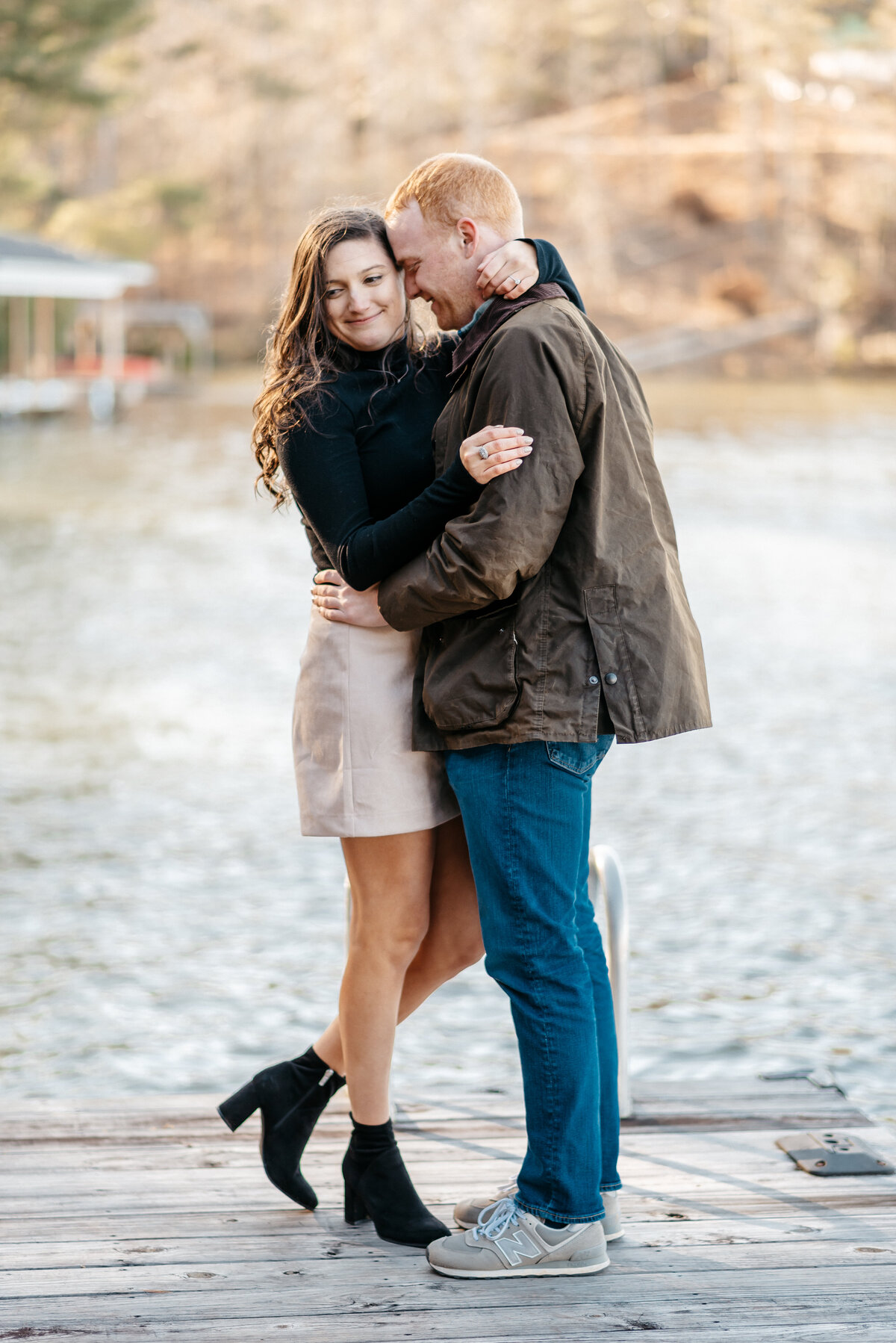 Couple hugging during their photo session for their engagement photographer in Wilmington, NC
