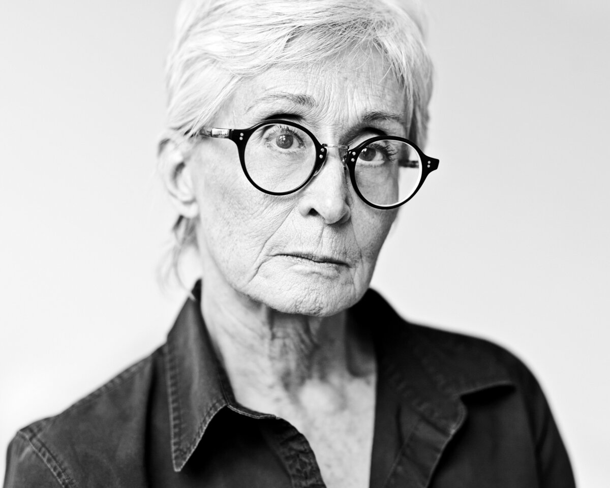 Black and white photo of a woman with glasses