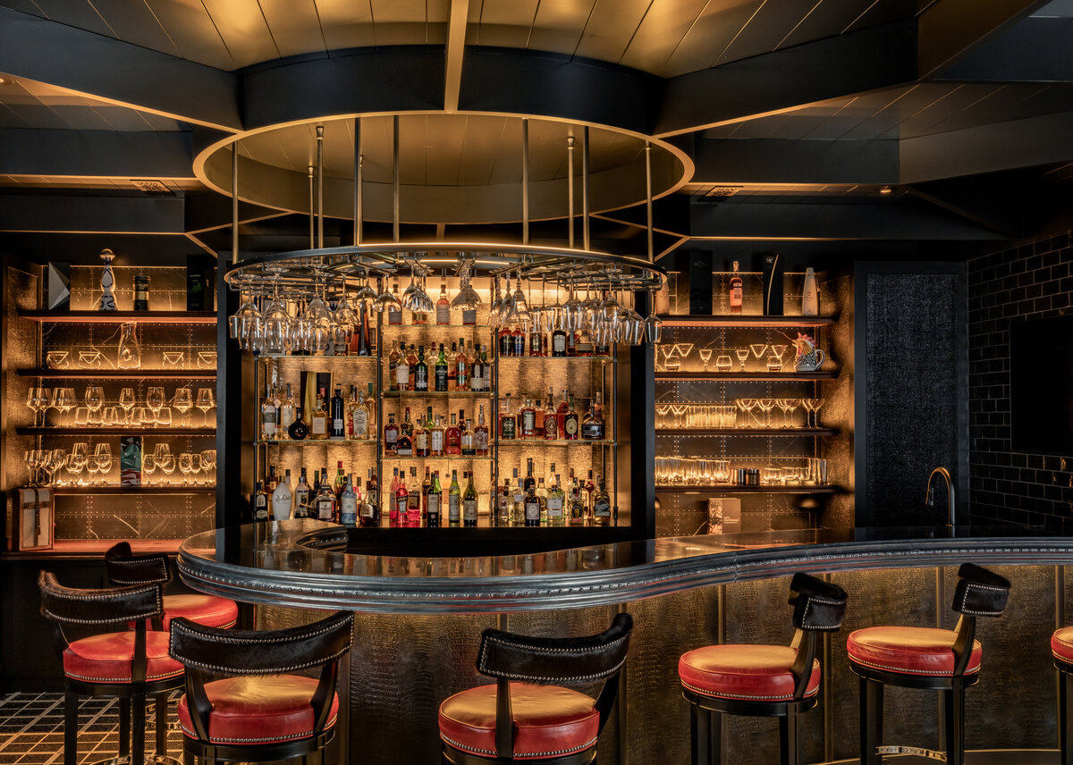 moody bar with red bar stools