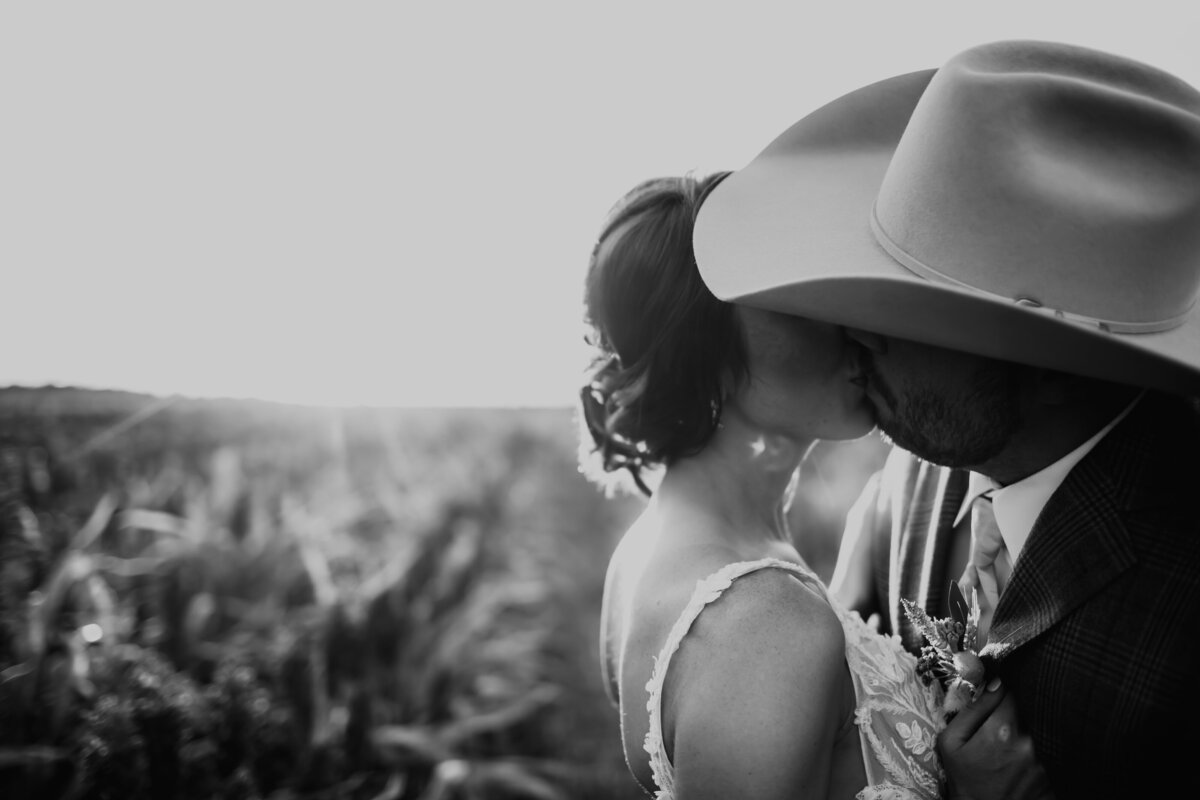 WEDDING DAY KISS IN MILO FIELD IN NORTON KANSAS