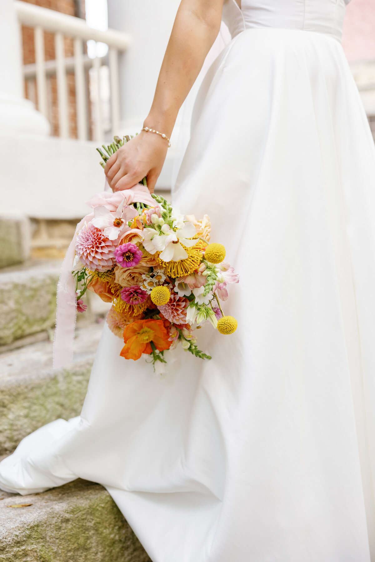 Bride holding colorful wedding bouquet, Wilmington bridal portrait with floral focus