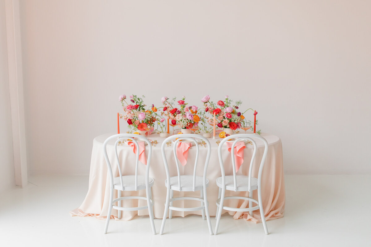 wedding table with bright colorful florals
