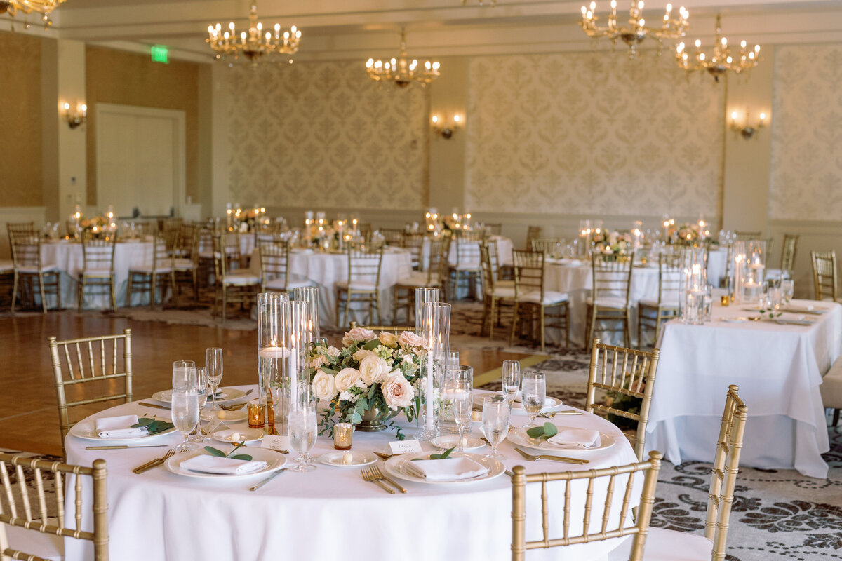 Riviera ballroom with white linen and small center pieces