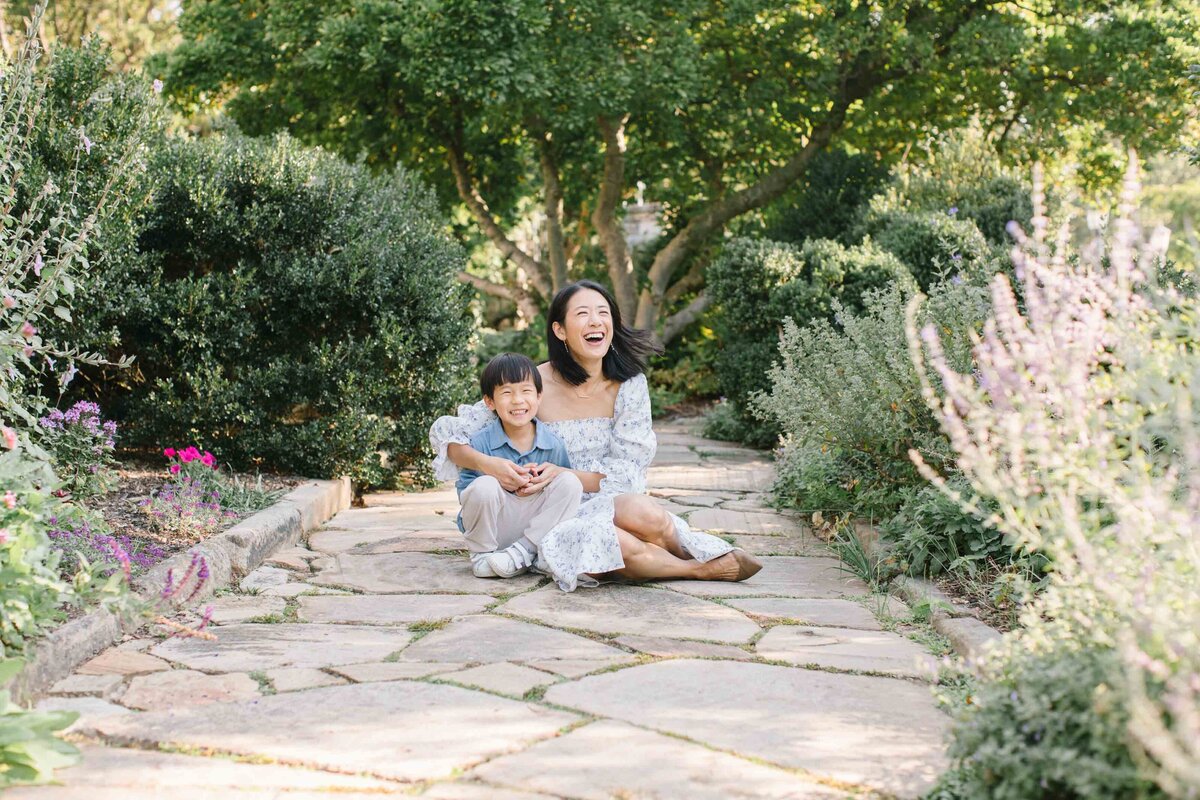 little boy with mother in garden having photos taken