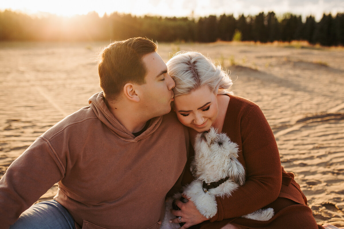 couple photos at edmonton beach with their dog