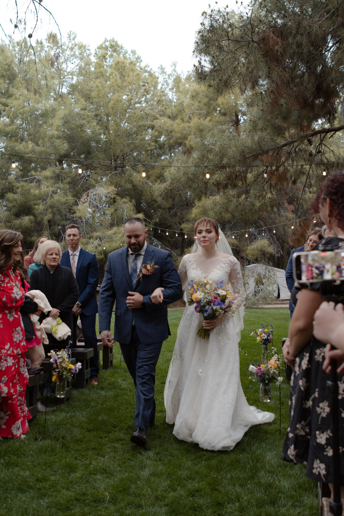 Jovanna G Photography. Classic, sophisticated Wedding Photos. Soft romantic engagement photos. Soft romantic WeddingPhotos. Sophisticated Wedding Photographer. Professional Wedding Photographer. Destination Wedding Photographer. Luxury Wedding photographer. Traveling Wedding Photographer. AZ Wedding Photographer. Gilbert AZ Wedding Photographer. Queen Creek Wedding Photographer. Phoenix Wedding Photographer. Scottsdale Wedding Photographer. Flagstaff Wedding Photographer. SoCal Wedding Photographer. California Wedding Photographer. Northern California Wedding Photographer. Southern California Wedding Photographer. San Francisco Wedding Photographer. Bay Area Wedding Photographer. San Jose Wedding Photographer. Golden Gate Bridge Wedding Photographer. Beach Lover Wedding Photographer. Palace of the Fine Arts Wedding Photographer. Ocean Lover. I love California. Orange County Wedding Photographer. Newport Beach Couples Photographer. Newport Beach Wedding Photographer. Laguna Beach Couples Beach Engagement Photographer. Laguna Beach wedding beach photographer. Los Angeles Wedding Photographer. Young and in love engaged couples who live in southern California. Christian Young Couple. Young Engaged Couple. Engaged High School Christian Couple. Christian Values. Young conservative Christian women. Young Conservative Christian men. Young Conservative Christian Couple. Young Christian Couple Engaged in High School. Young Christian College Couple. Forest, Flora Wedding for the Fergusons. Arizona Flagstaff Wedding. Arizona Flagstaff Wedding Cloudy, Rainy day. Detail Flatlays. Details Checklist. Vow books. Ring box. Jewelry. Florals. Groom’s Details. Hunter and Julia Forest pine tree wedding. Pine Top Cloudy Rainy day Wedding day. Pine tree mountain wedding. California pine mountain tree wedding day. Outdoor rainy day wedding in the mountains. Mountain top pine tree outdoor spring wedding. Green bridesmaids dresses. Fun wedding party. Venue at Schnepf Farms. Wild Blume Florals. Makeup by Laly Harr. David’s Bridal. Womack Services AZ. Inspired Sugar Cake.