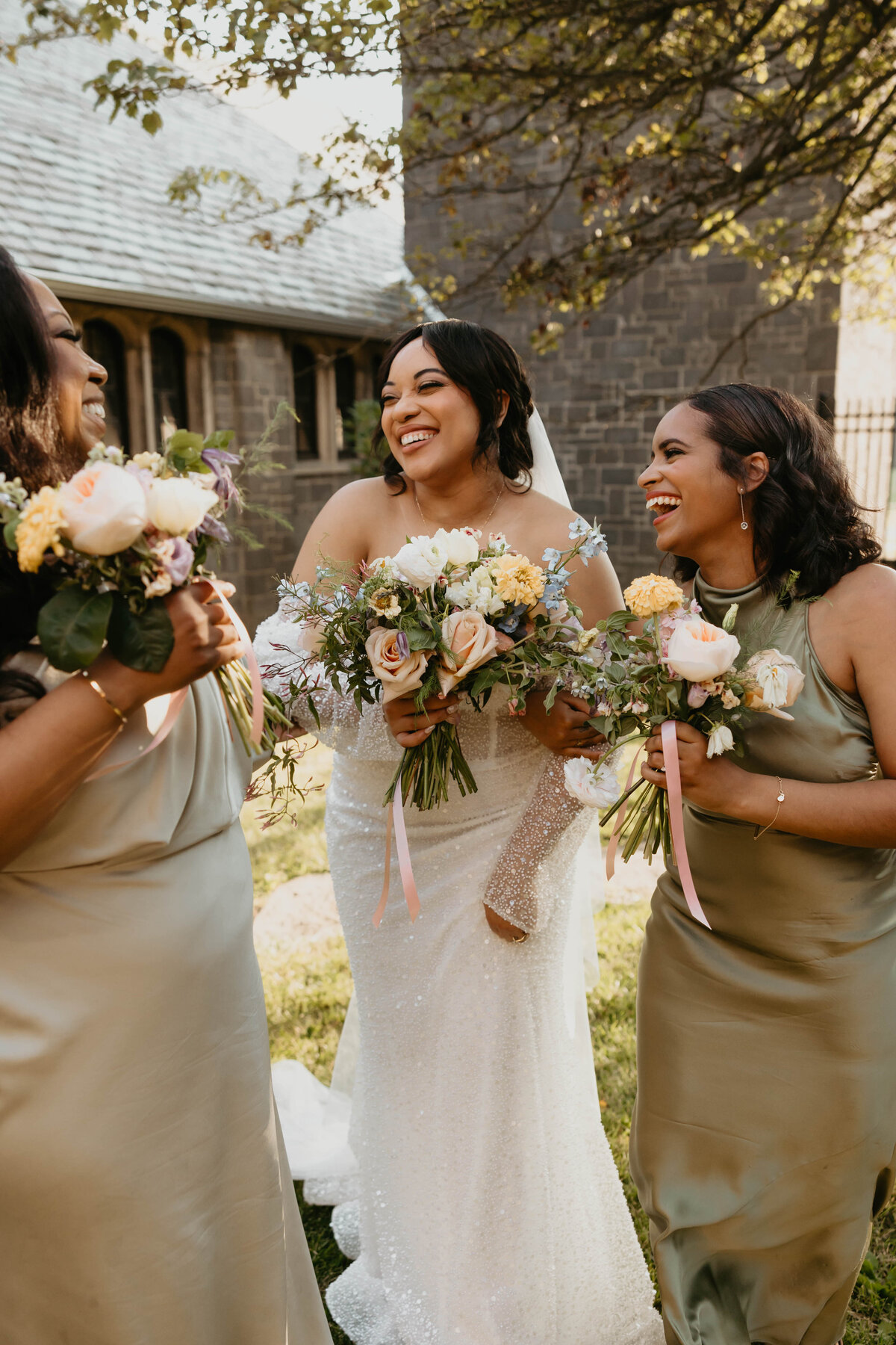 Bride and bridesmaids smiling at luxury wedding in Pittsburgh