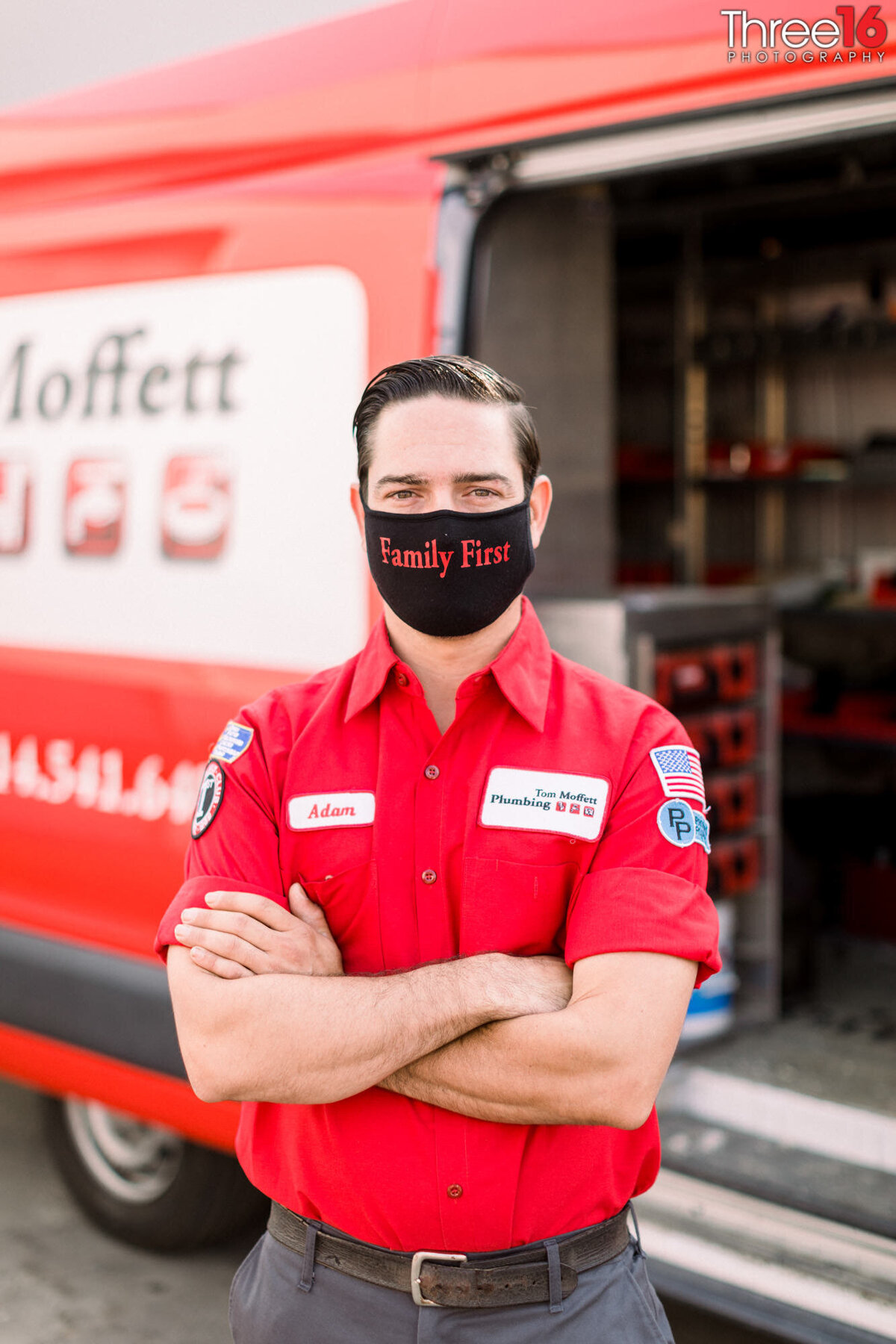 Plumber poses with arms crossed wearing a Covid mask before starting his day