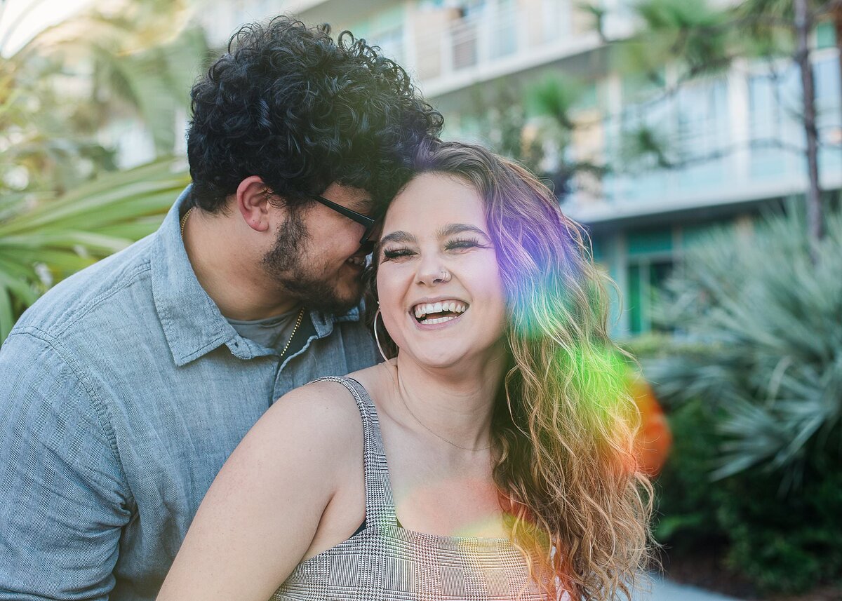 Engagement shoot couple laughing at Disney's Old Key West