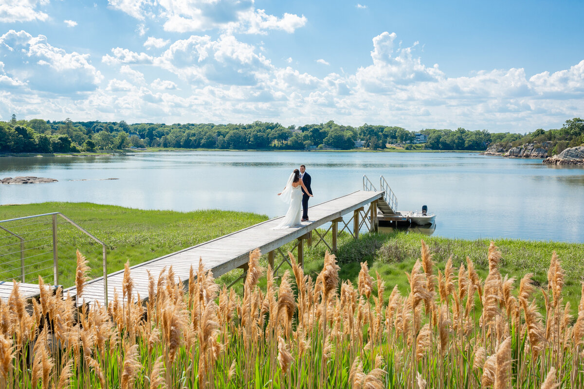 first-look-blue-sky-clouds-dock-bride-groom-lisa-gilbert-photography