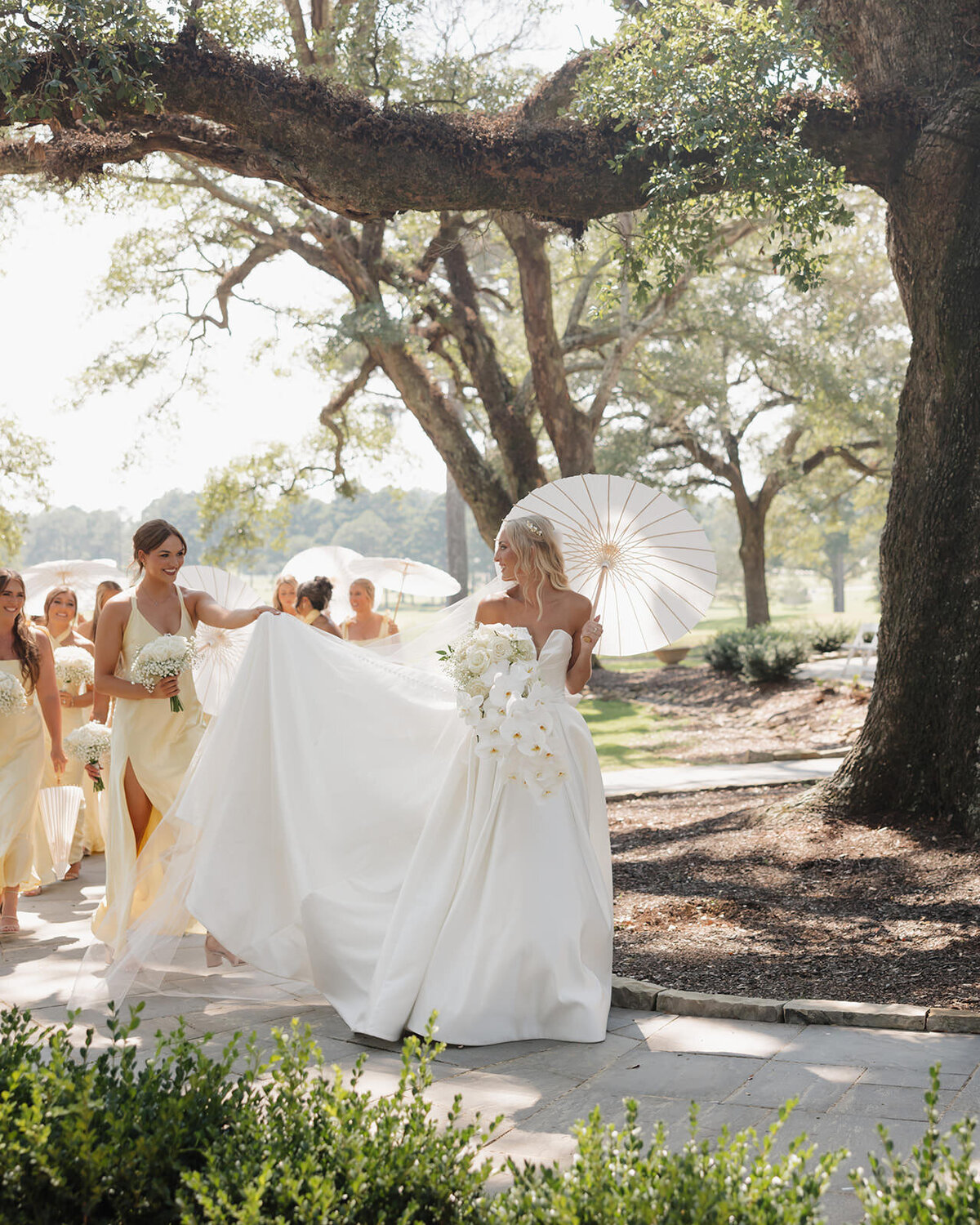 bride and bridesmaids walk to wedding ceremony