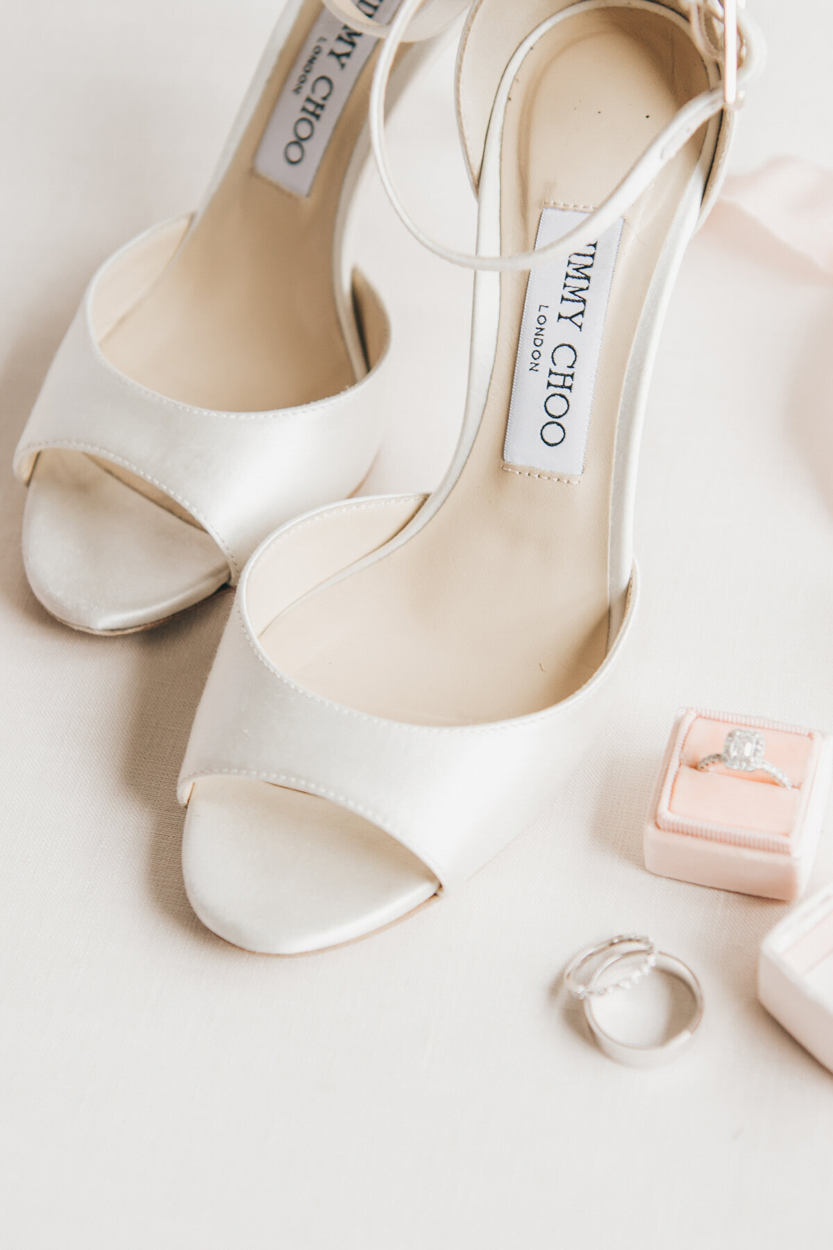 Detail shot of white Jimmy Choo wedding heels photographed by Nova Markina
