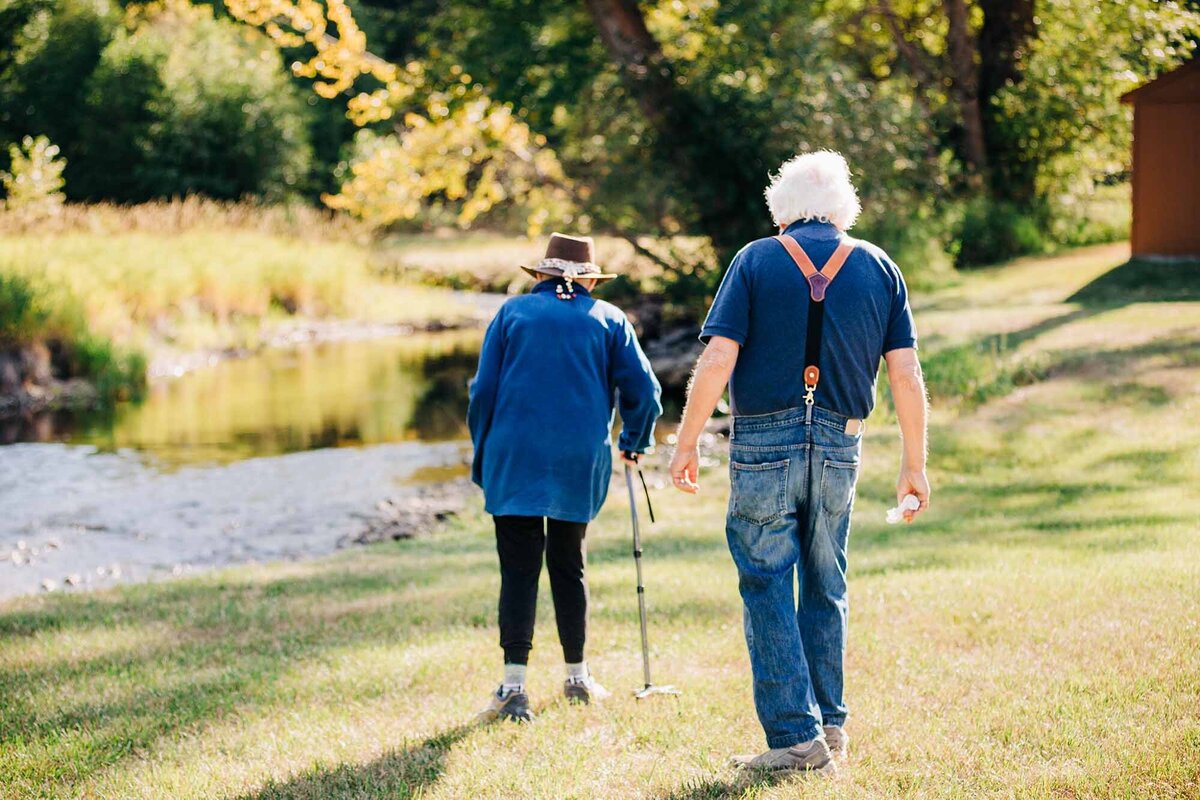 Elderly Montana couple walking together in Huson, Montana