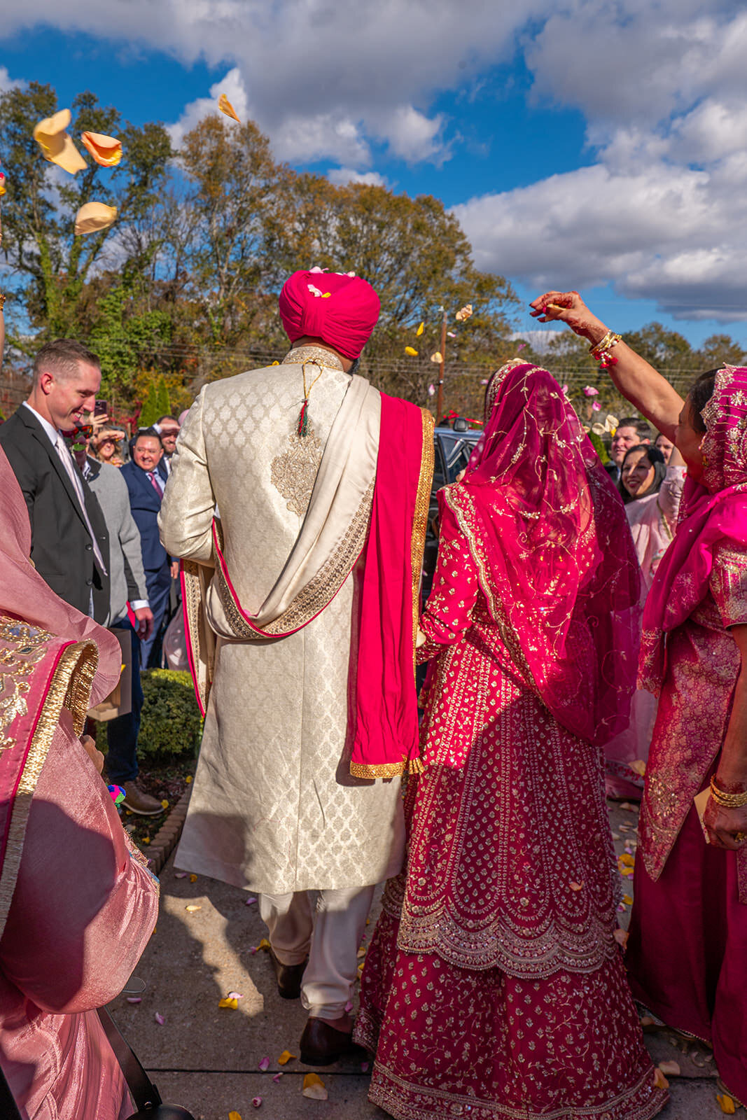 A wedding couple walking back up the aisle together 