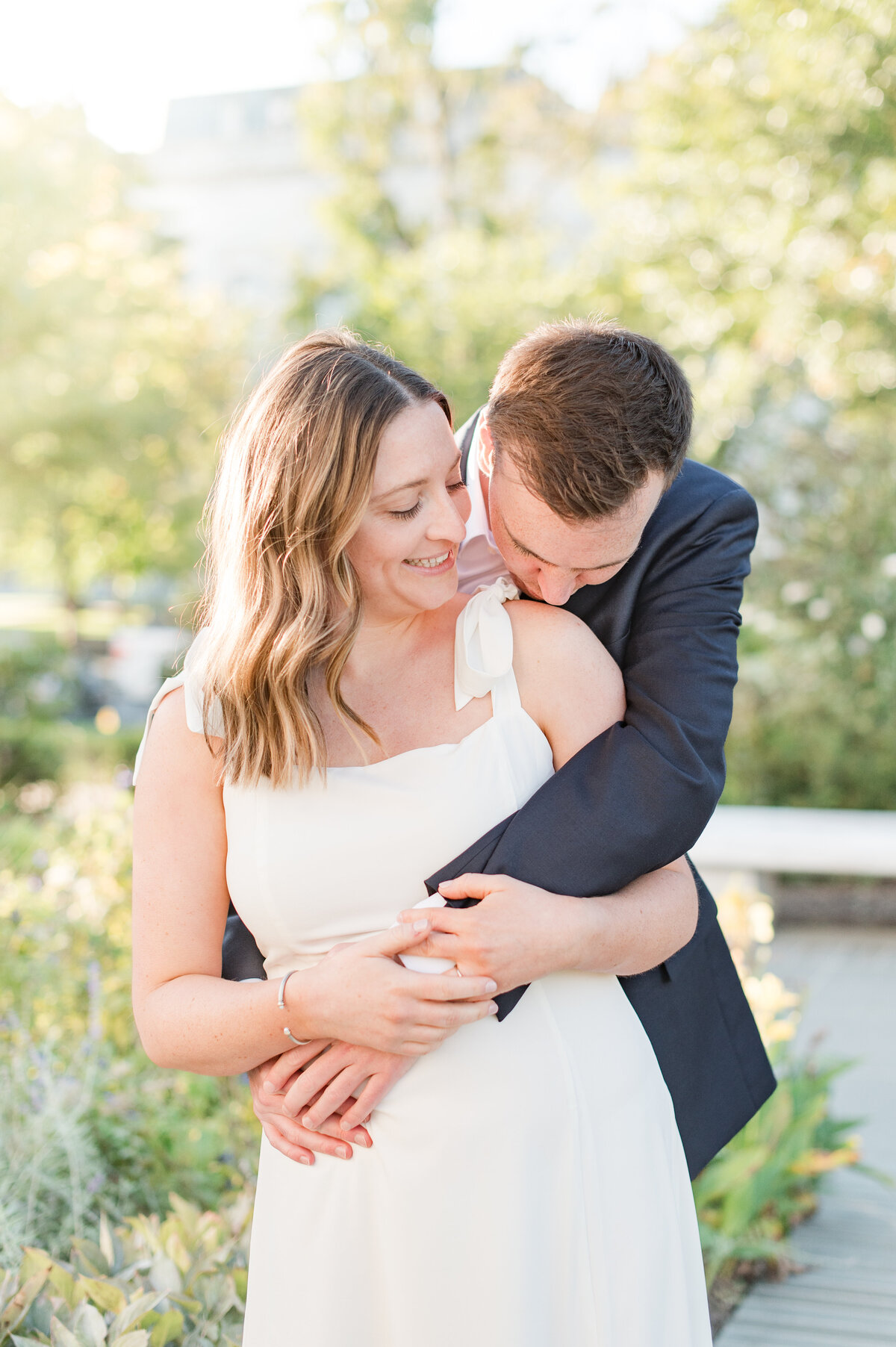 couple embracing at sunrise engagement session