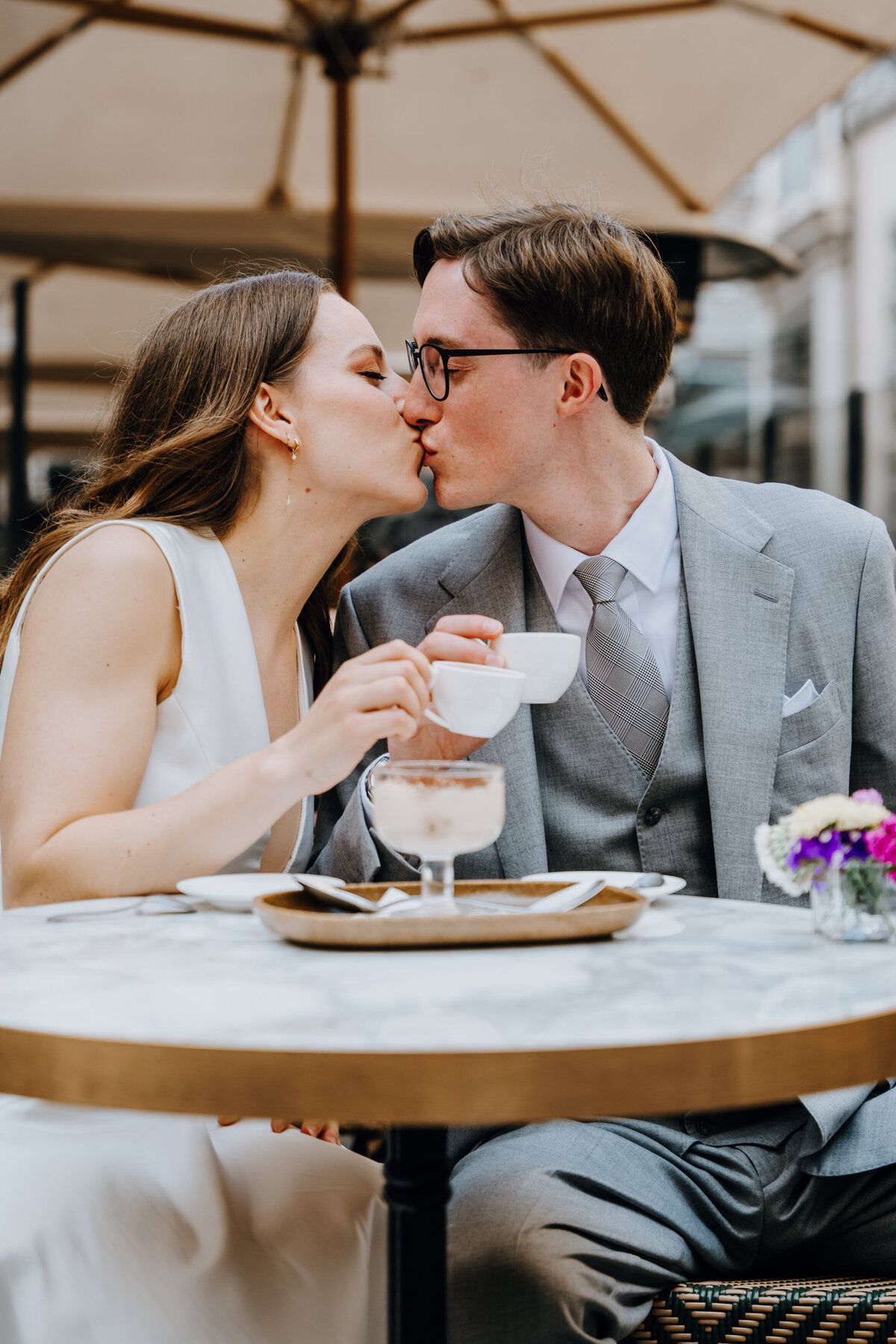 Intimate moment in a narrow Rome alleyway.