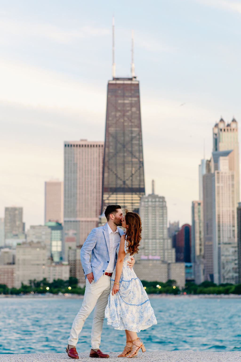 An engagement photography session at The Wrigley Building and North Ave Beach in Chicago, Illinois - 42