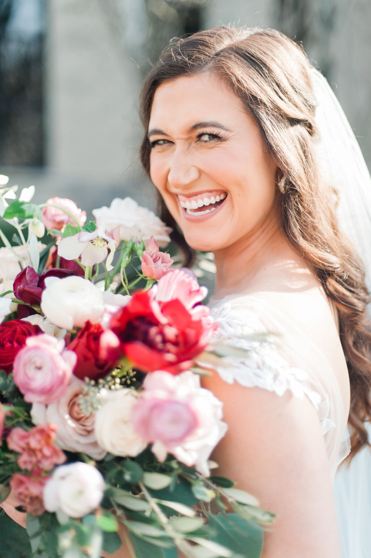 Happy bride and her bouquet | Bella Fleur