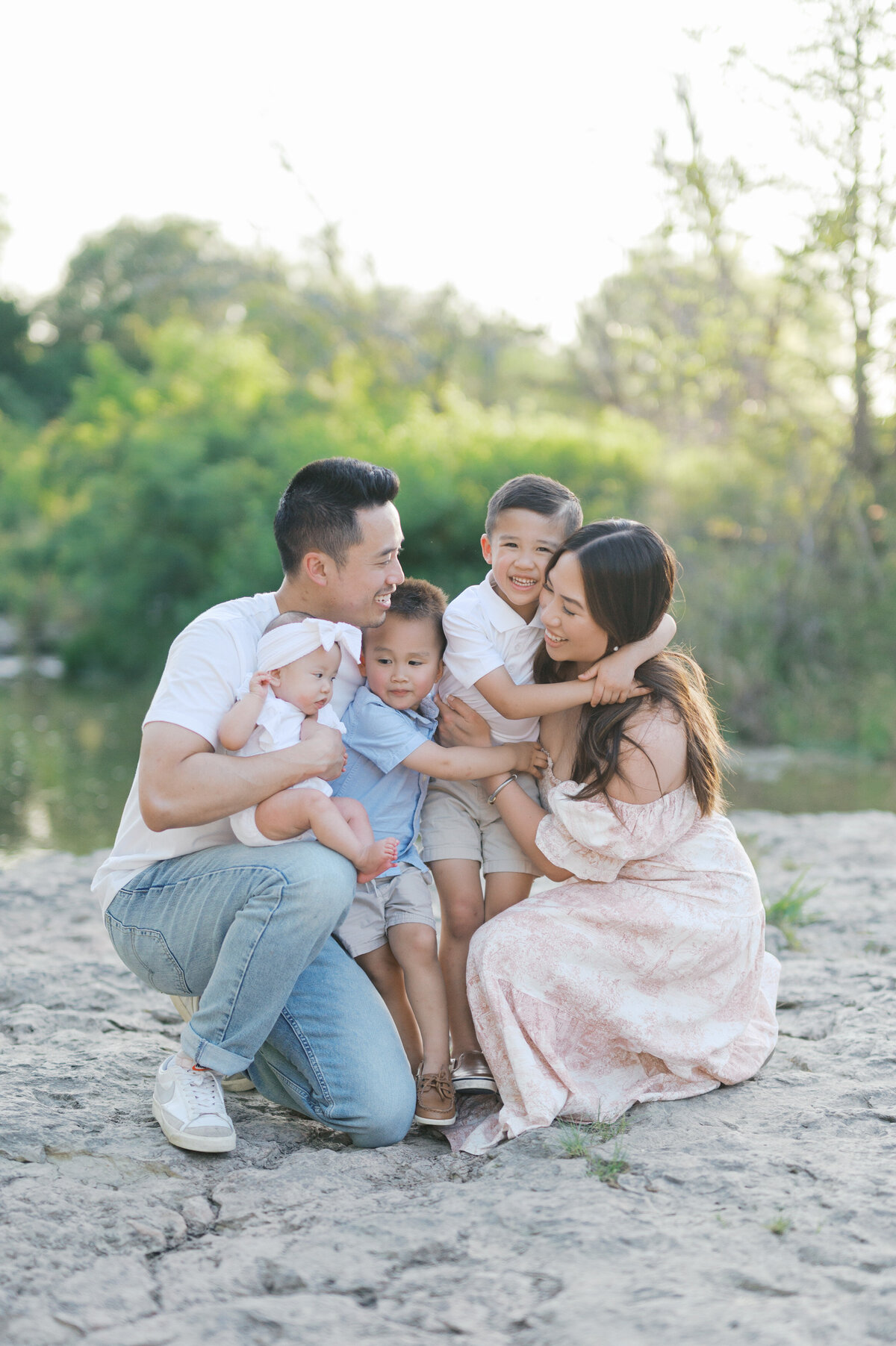 family photos creekside in north fort worth, family of 5 cuddles close