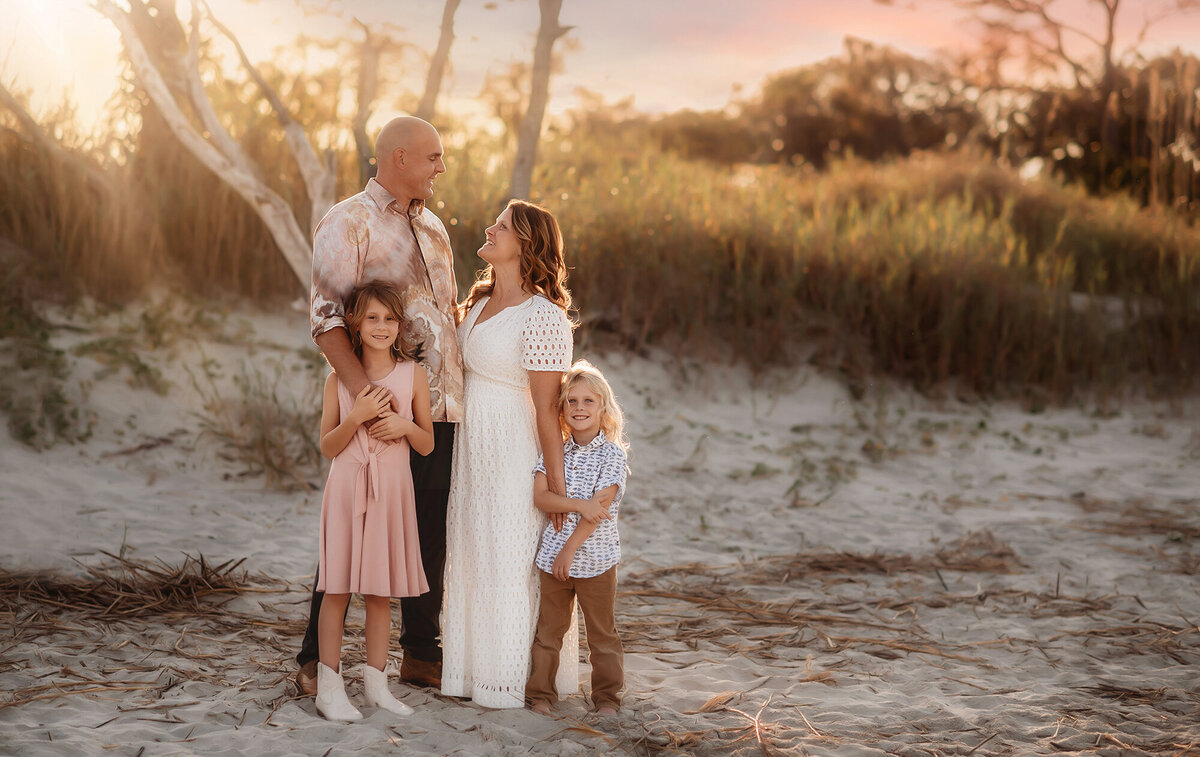 Family poses for Family Photos on Folly Beach.