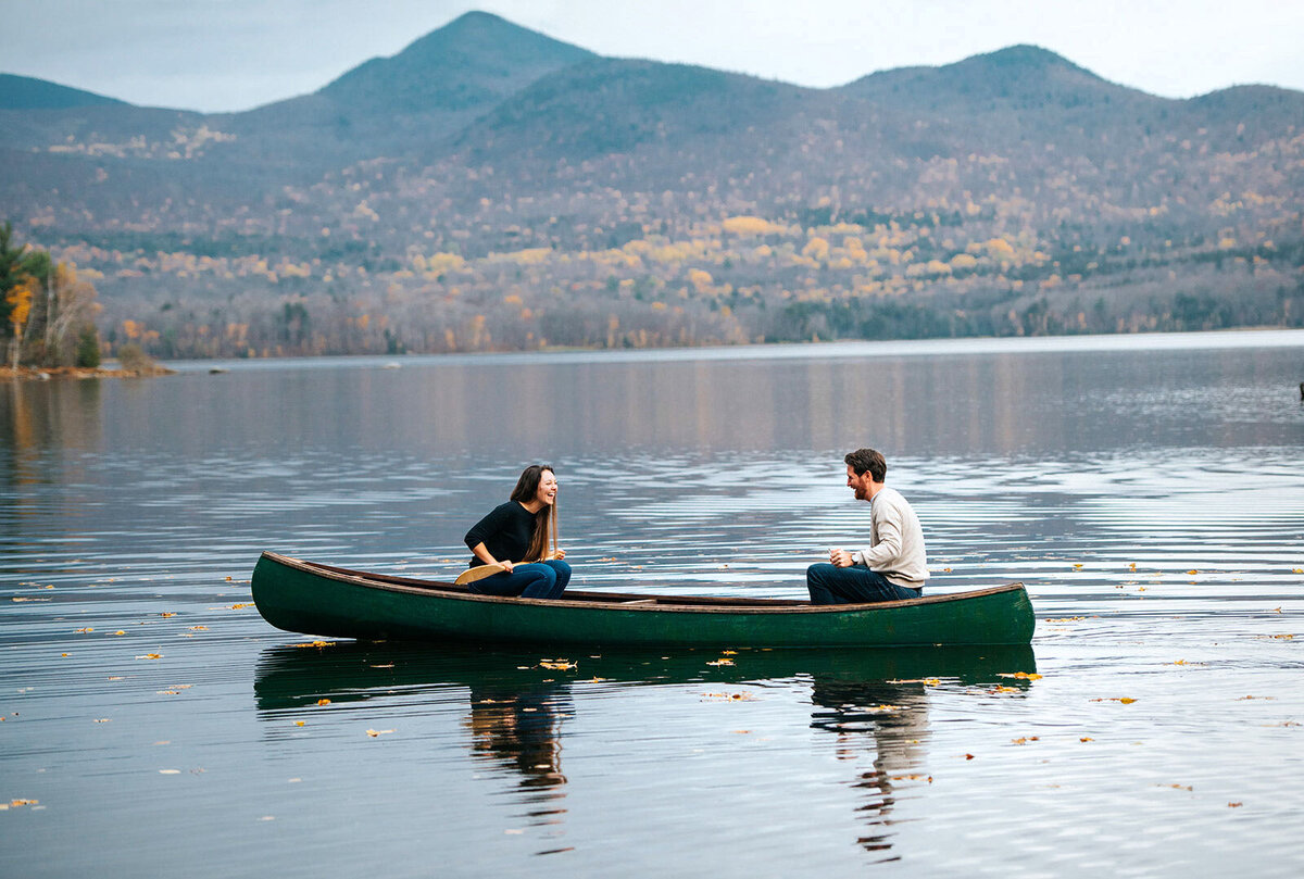 couple laughing in canoe chittenden vermont