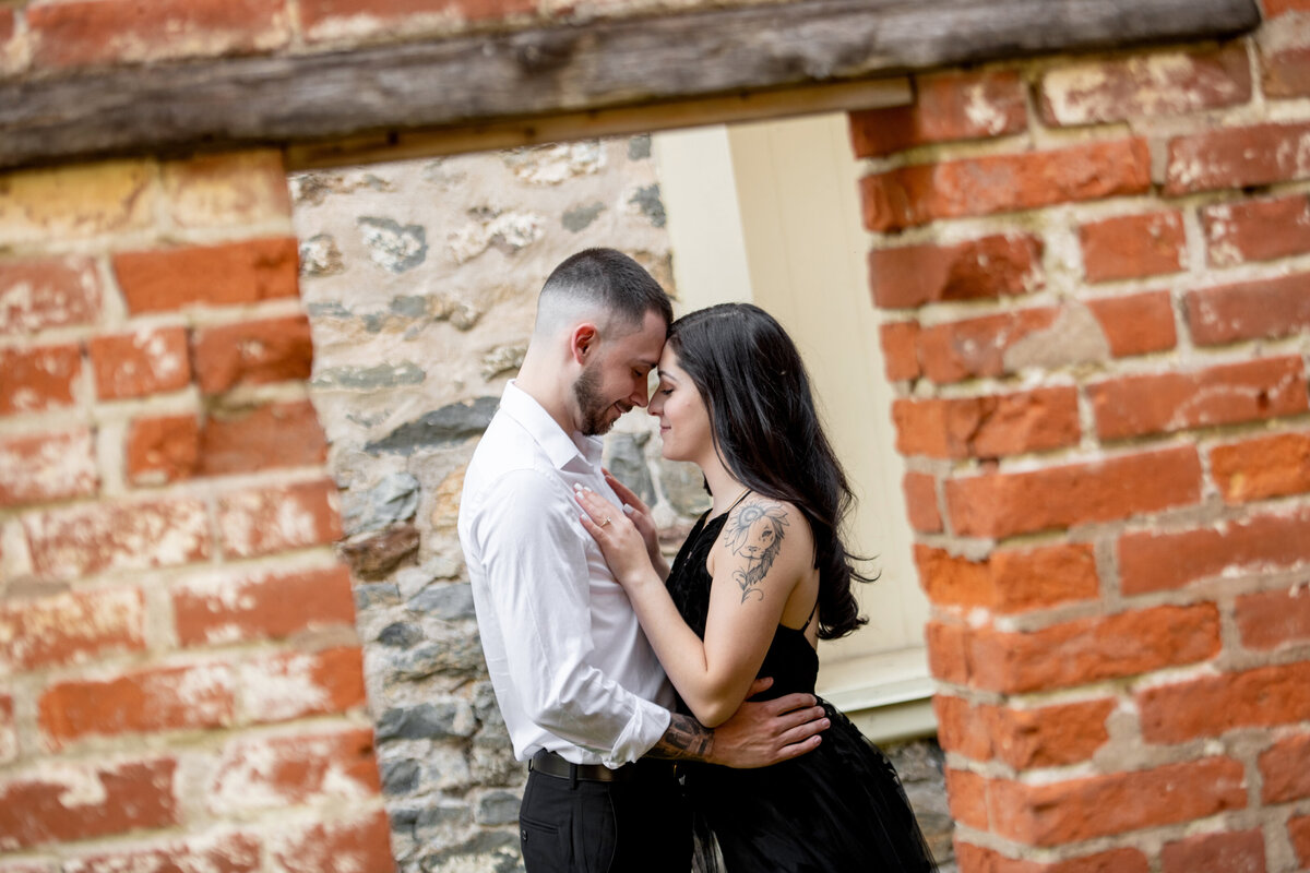 engaged_couple_abandoned_building_backdrop