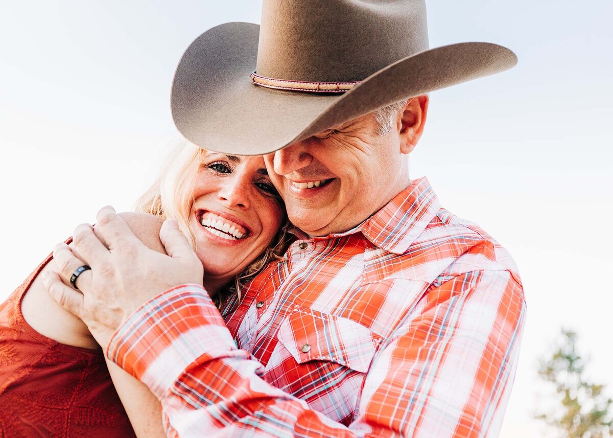 Engagement photo of man and woman hugging at Travelers' Rest State Park