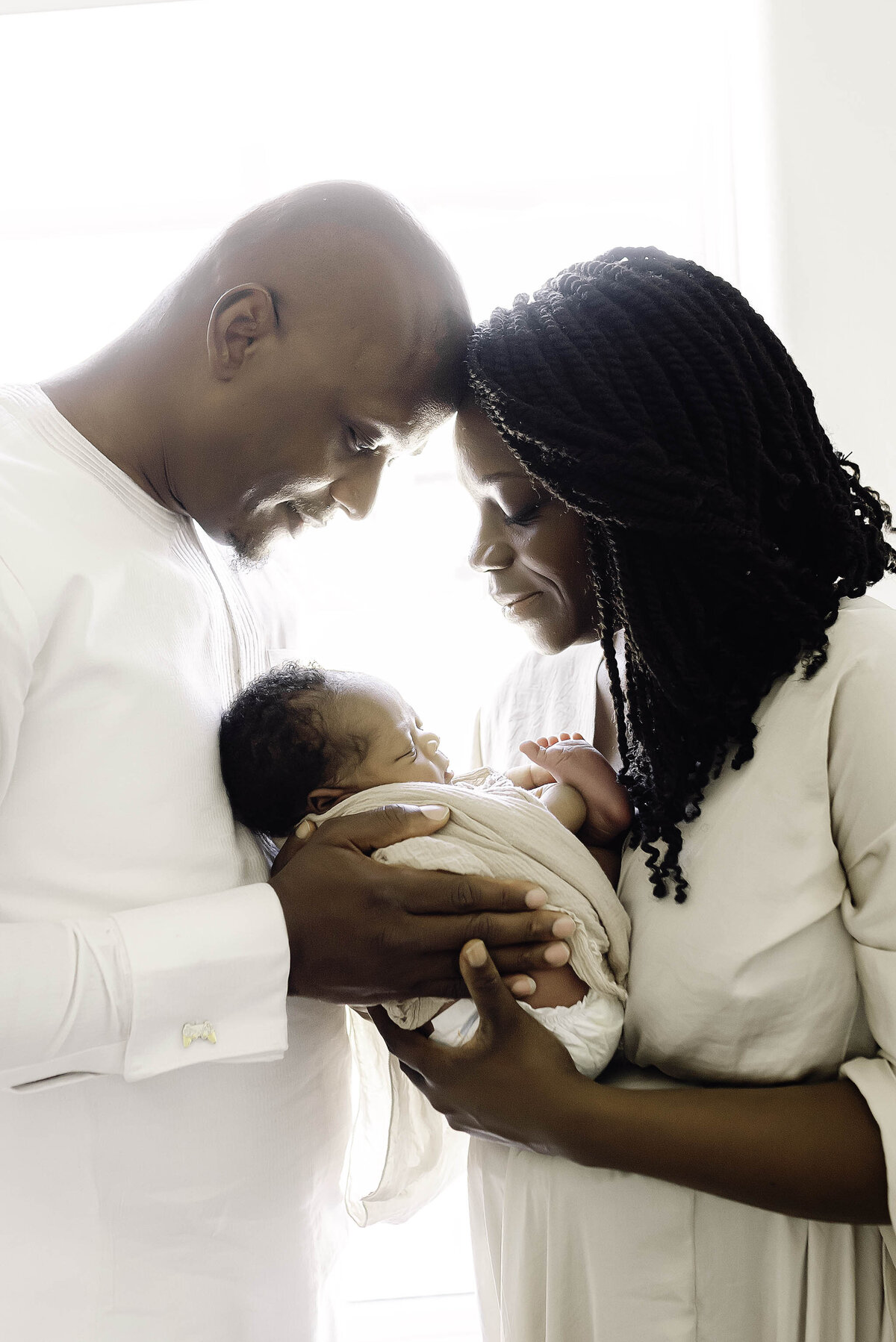 Mom and Dad and baby boy by window_SRJ0251-Edit copy