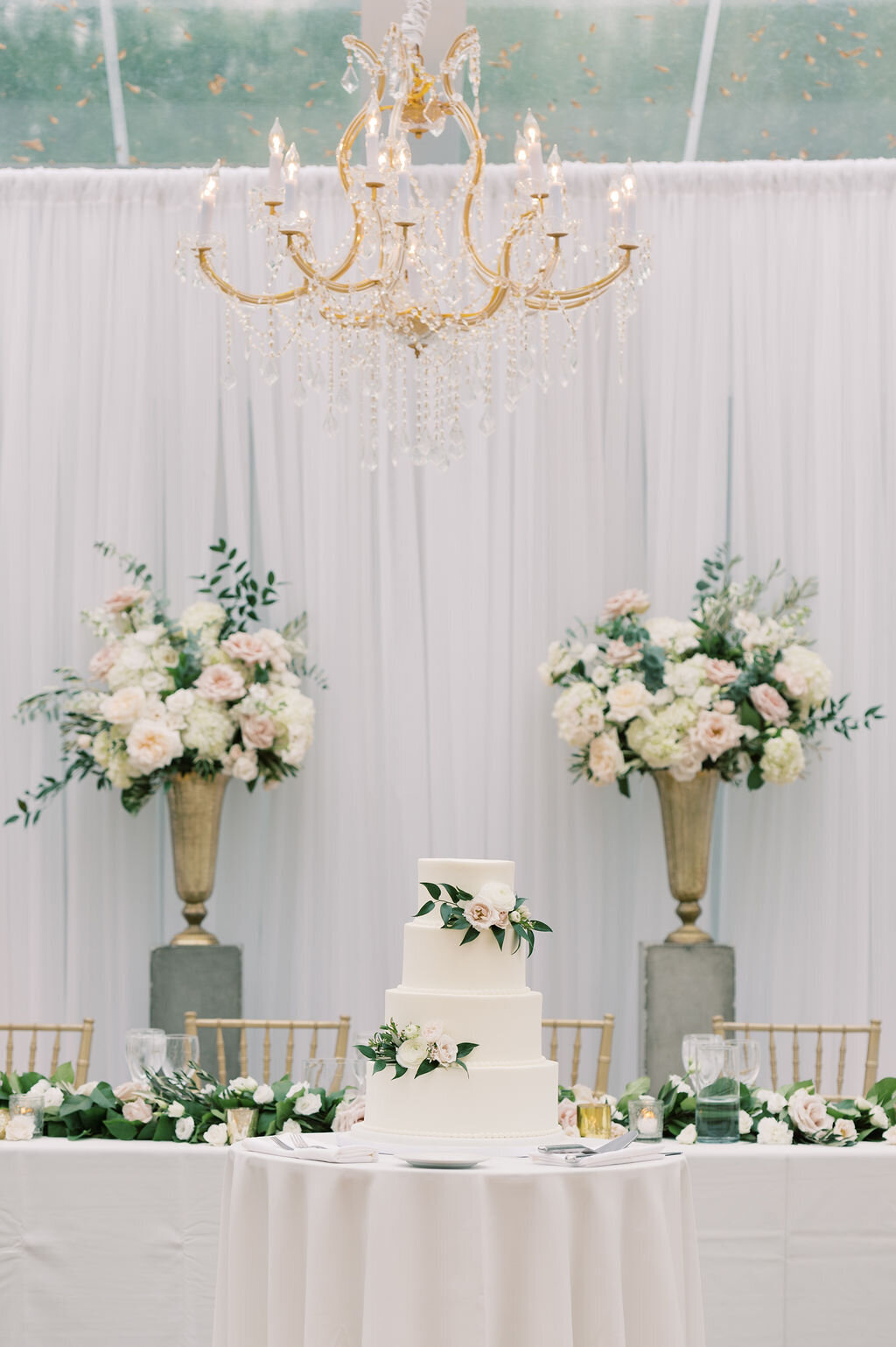 wedding cake under clear span tent
