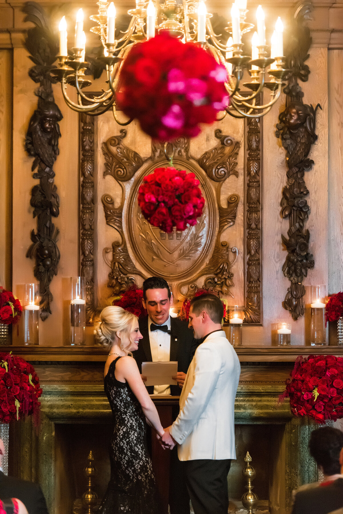 wedding ceremony with red roses in a room at the duquesne club pittsburgh