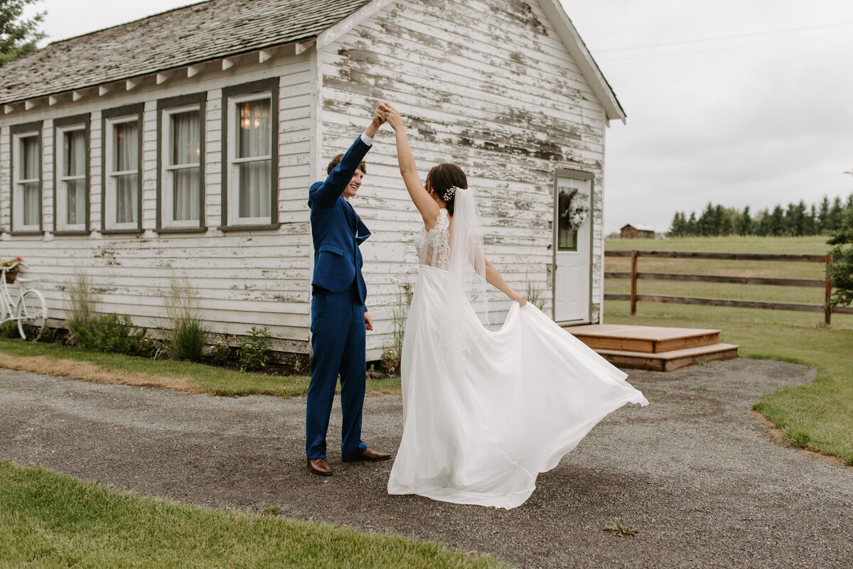 Couple dancing at Pine & Pond, a natural picturesque wedding venue in Ponoka, AB, featured on the Brontë Bride Vendor Guide.