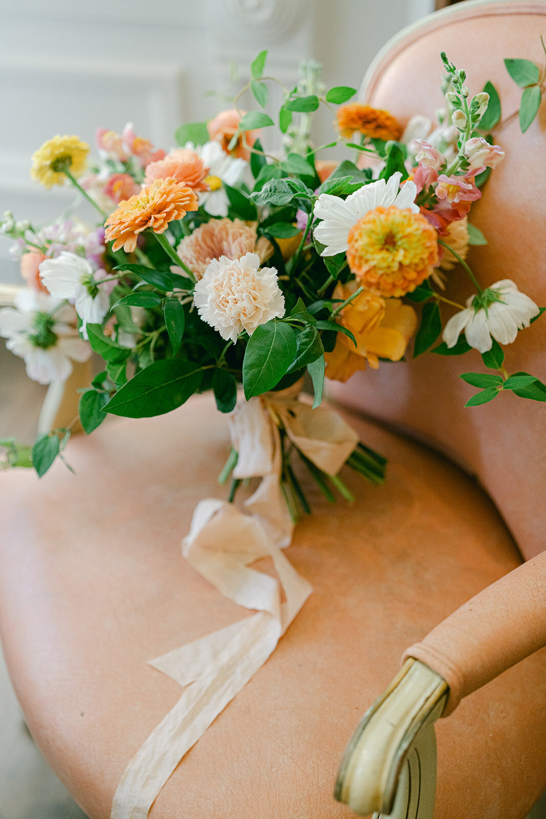 bridal bouquet in salmon chair at park winters
