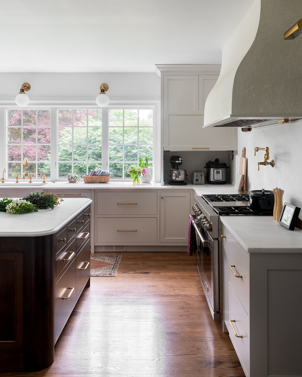 bright white kitchen with windows overlooking garden 