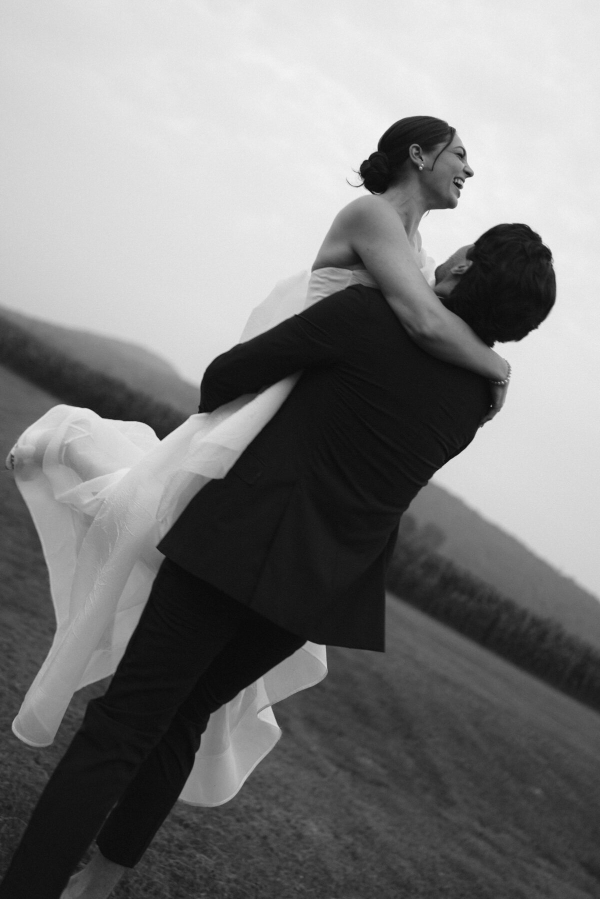 Captivating editorial wedding photography demonstrating sophisticated aesthetics at Lion Rock Farm venue. NYC photographer Lauren Alatriste combines fashion photography techniques with genuine emotion, creating luxury wedding imagery that
transcends traditional documentation boundaries.