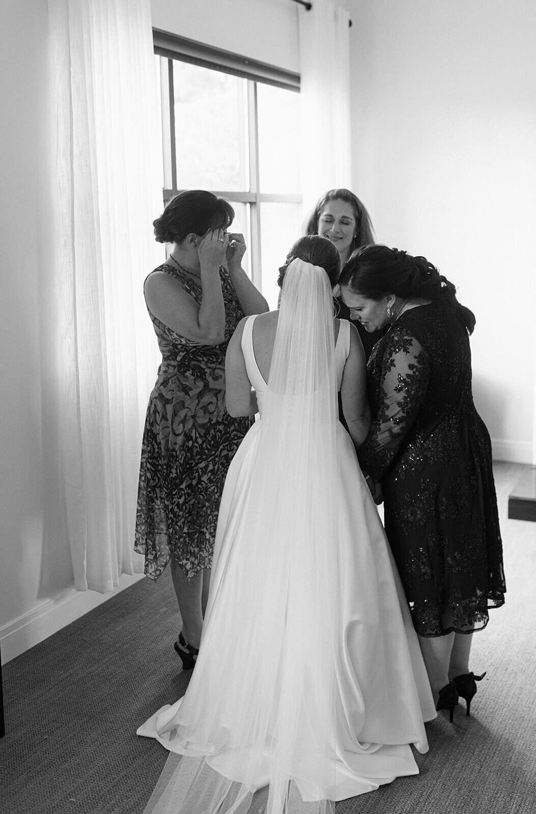 Bride with family surrounding her