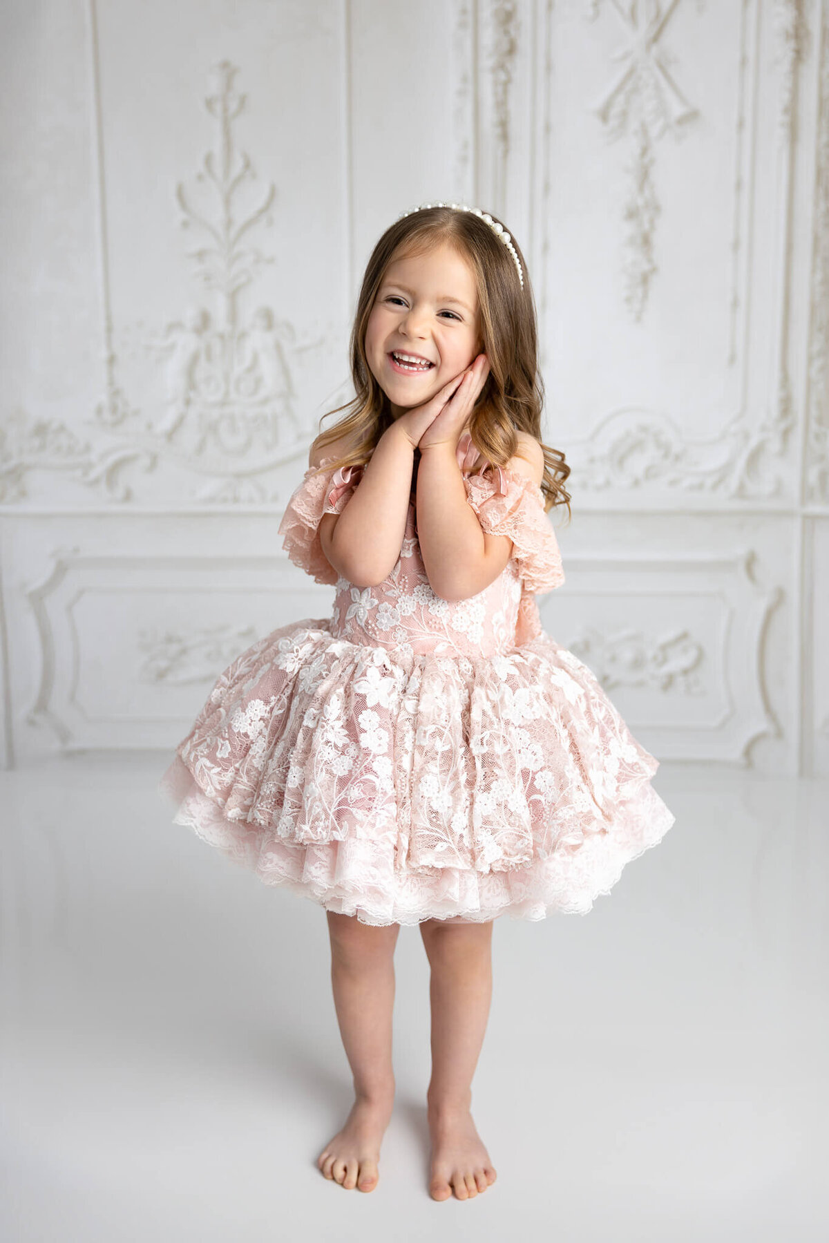 Fine art portrait of child in couture dress with soft lighting
