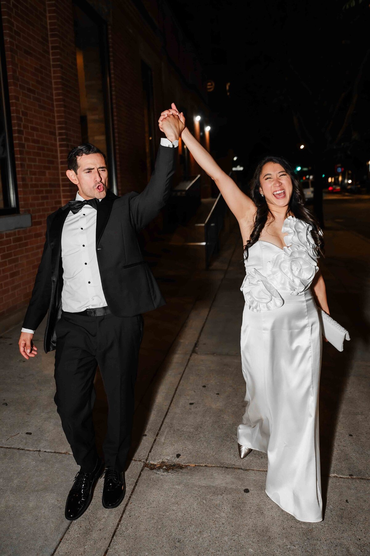 Bride and groom celebrate on a Chicago street