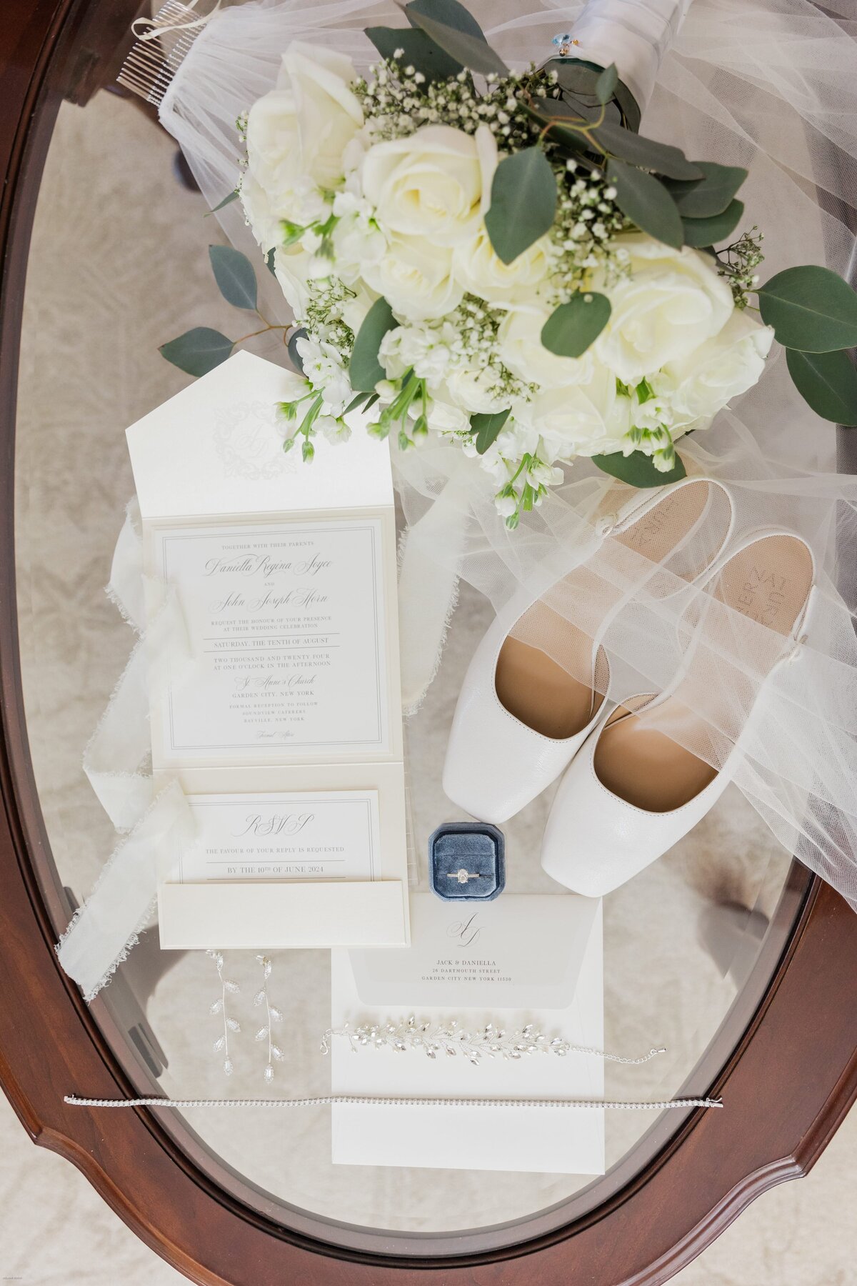 Wedding invitations, shoes and rings