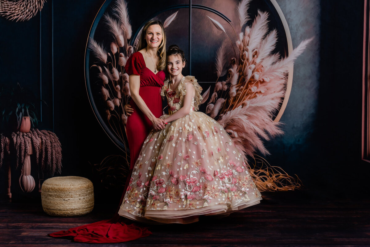 Mom and daughter hug in boho themed Prescott family photos