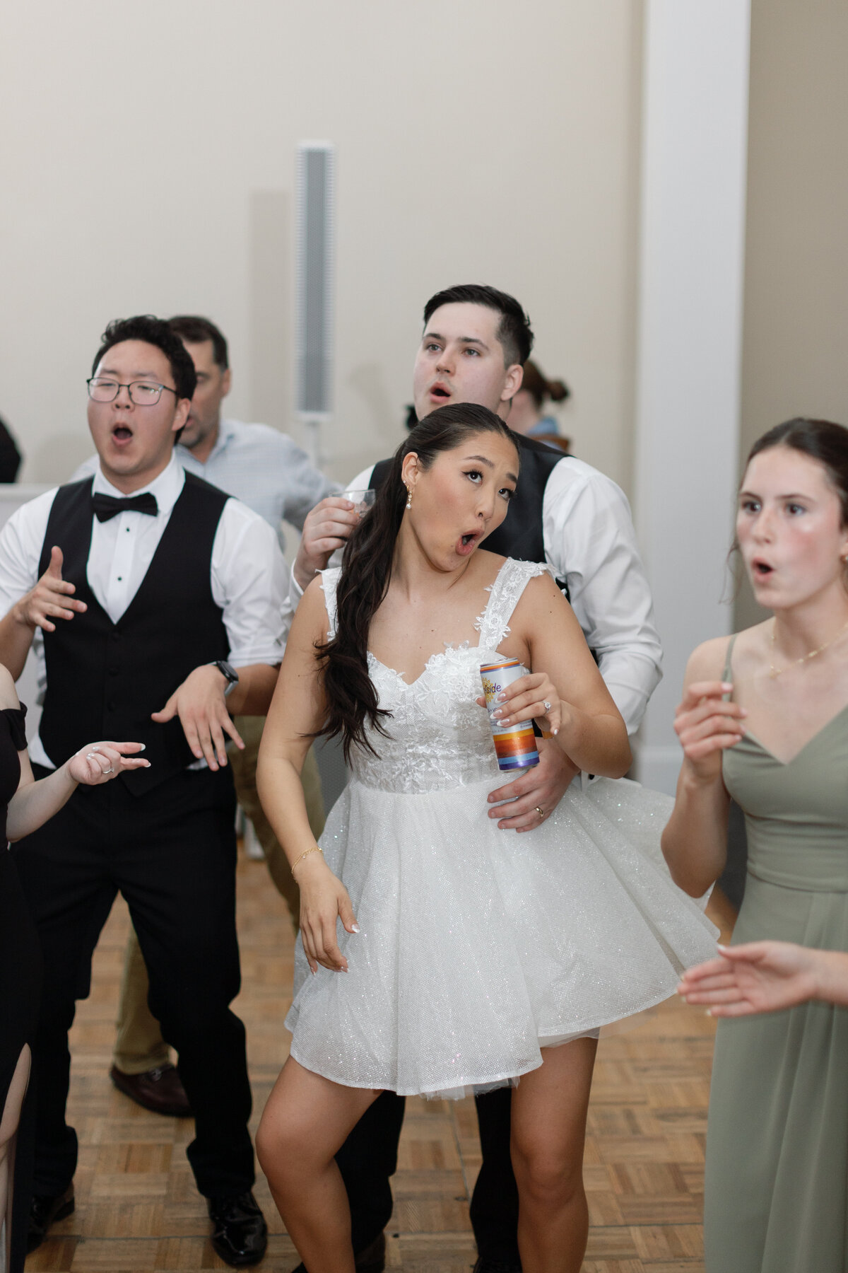 Wedding guests celebrating and dancing on dance floor with DJ Jake Sherman from Washington Talent at Springfield Manor.