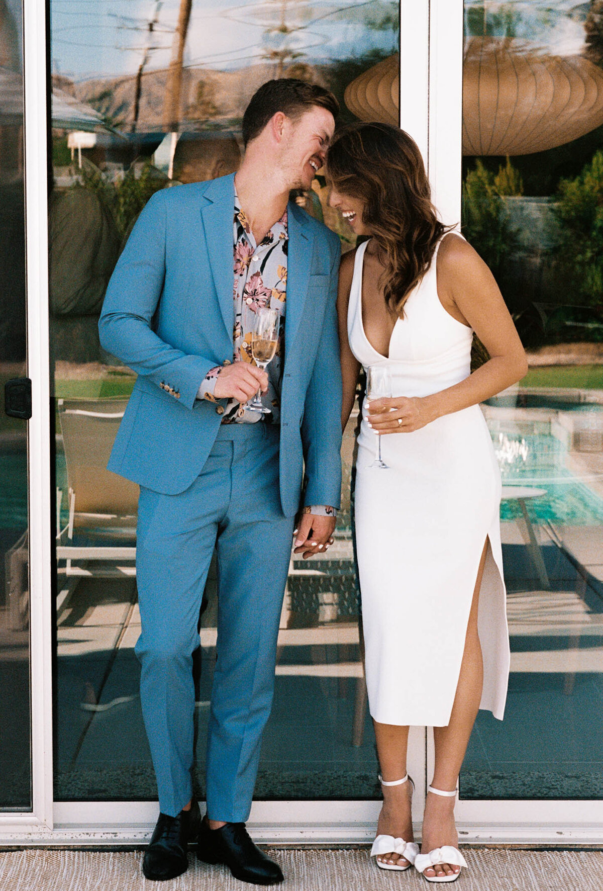 couple with drinks in hand for engagement shoot
