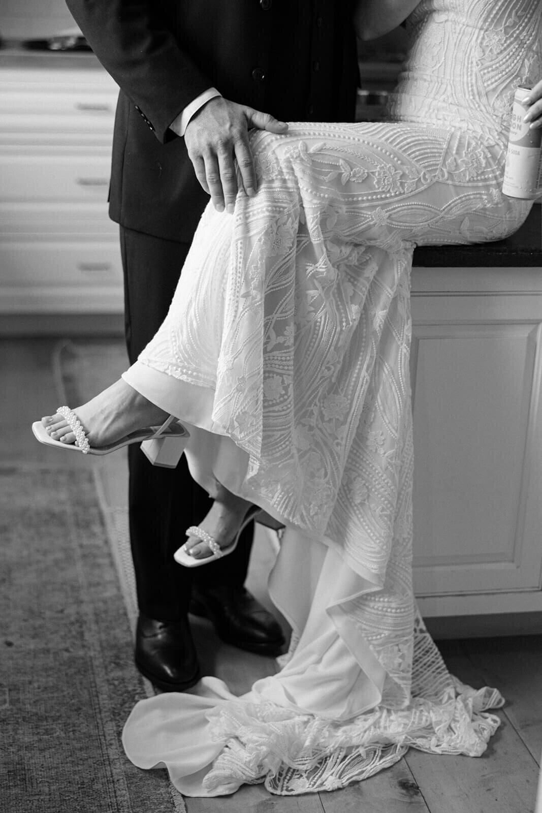 Groom has hand on brides knee
