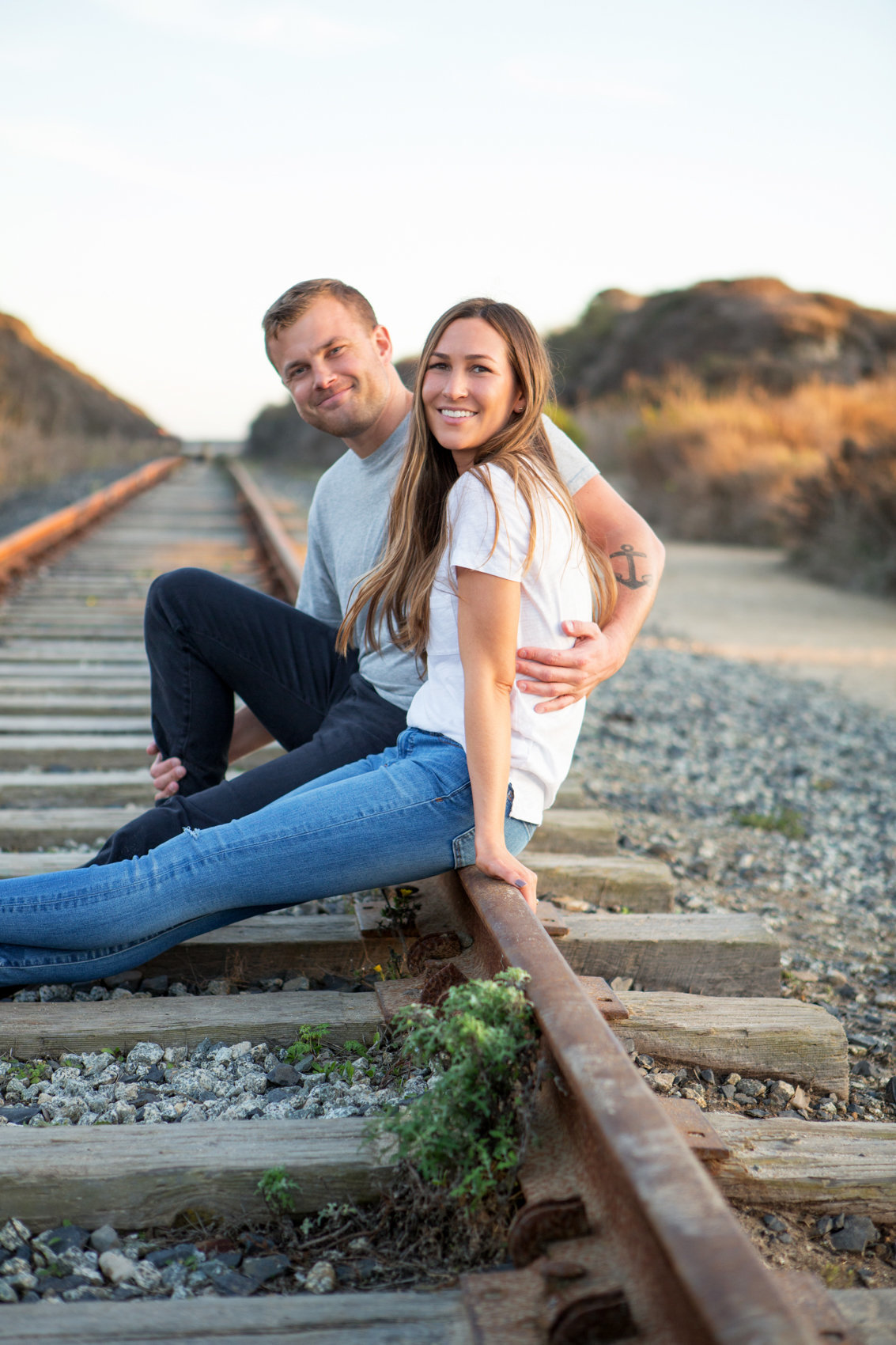 Golden hour engagement session, young couple, davenport california with deneffe studios