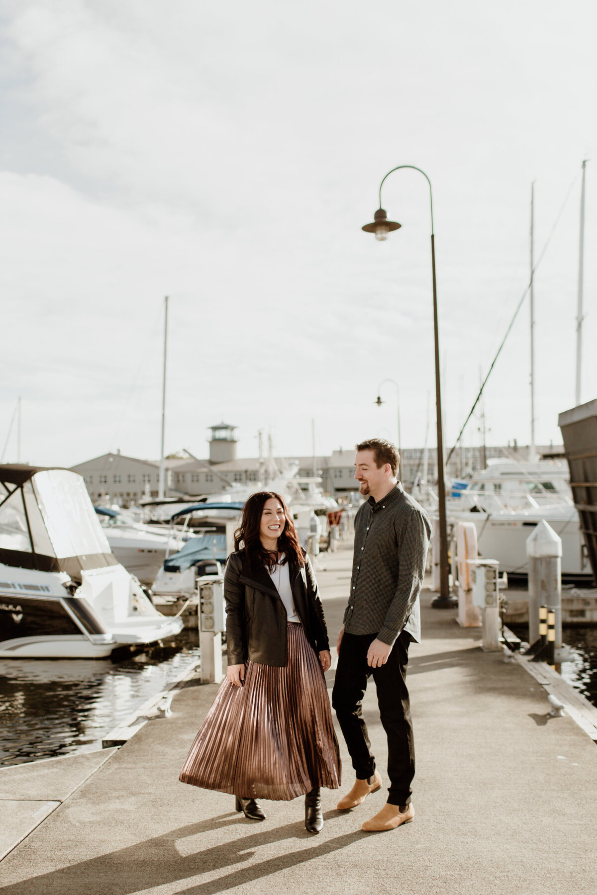 A candid and playful engagement session at Fisherman’s Terminal captured by Fort Worth Wedding Photographer, Megan Christine Studio