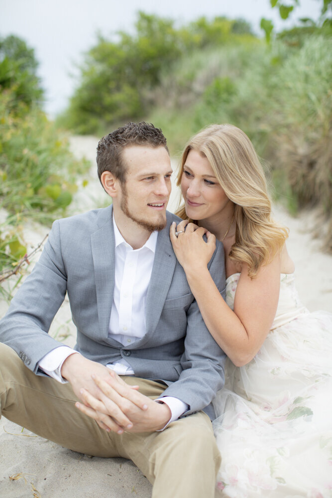 couple sitting on the beach - Rhode Island engagement  portraits
