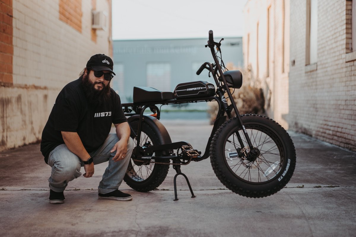 David Castillo posing with his Super73 S1 by Lithium Cycles @txpunisher